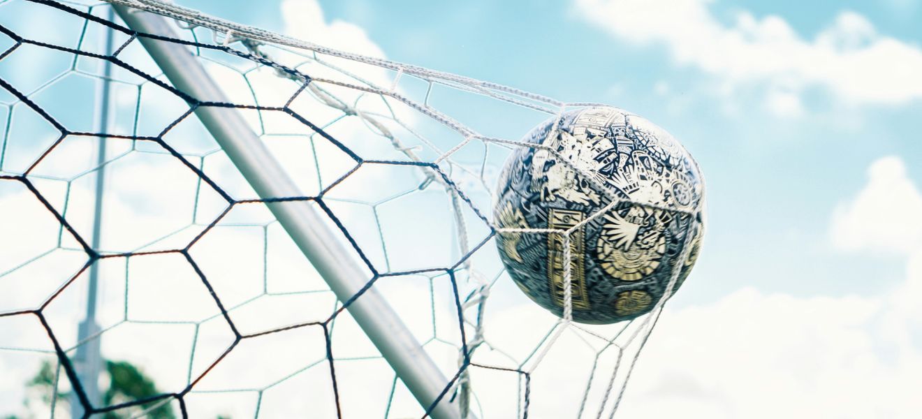 Football striking the back of a football goal net - Photo by chaossoccergear