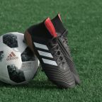 Football boots resting on ball