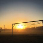 Football goal in the sunset 
